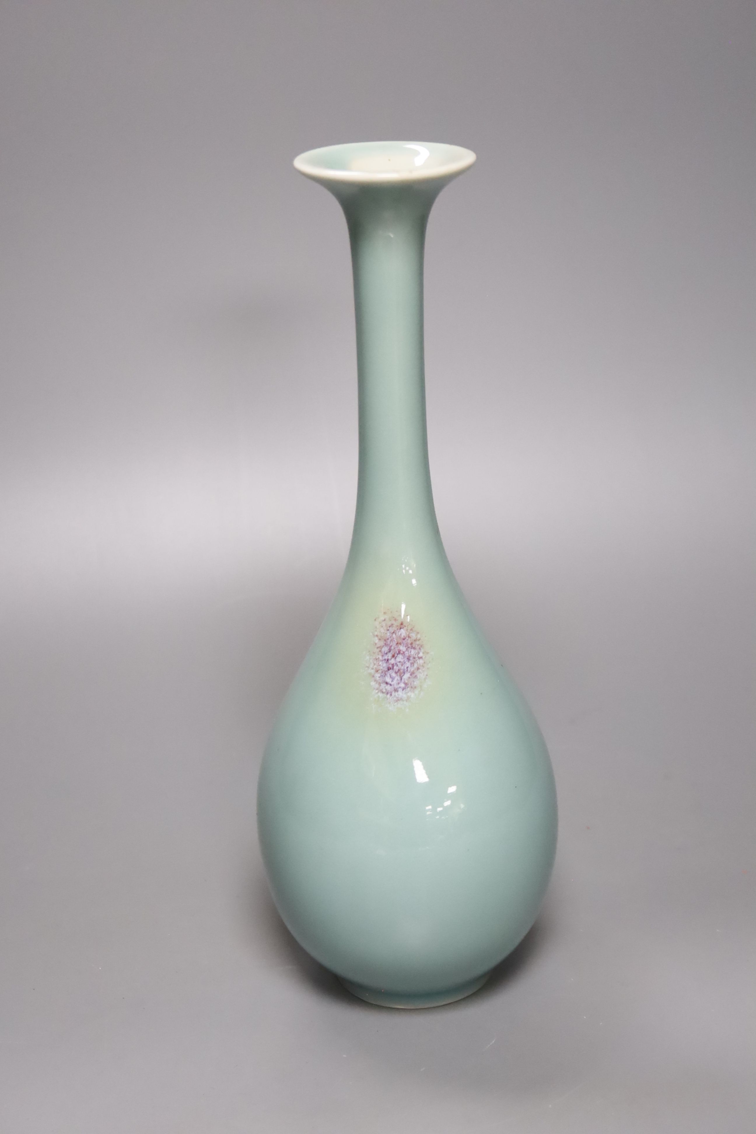 A Chinese celadon glazed vase, height 28cm, together with a crackle glaze bowl, a blue and white teabowl and saucer and a blue and white dish